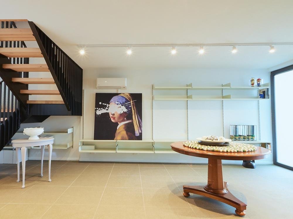 Ground floor entry with custom stairs and art